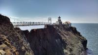 The Point Bonita Lighthouse with suspension bridge that provides access over the knife ridge joining it to the rest of the peninsula.