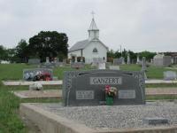 A wide angle view of the cemetery with a Ganzert family marker in the foreground.